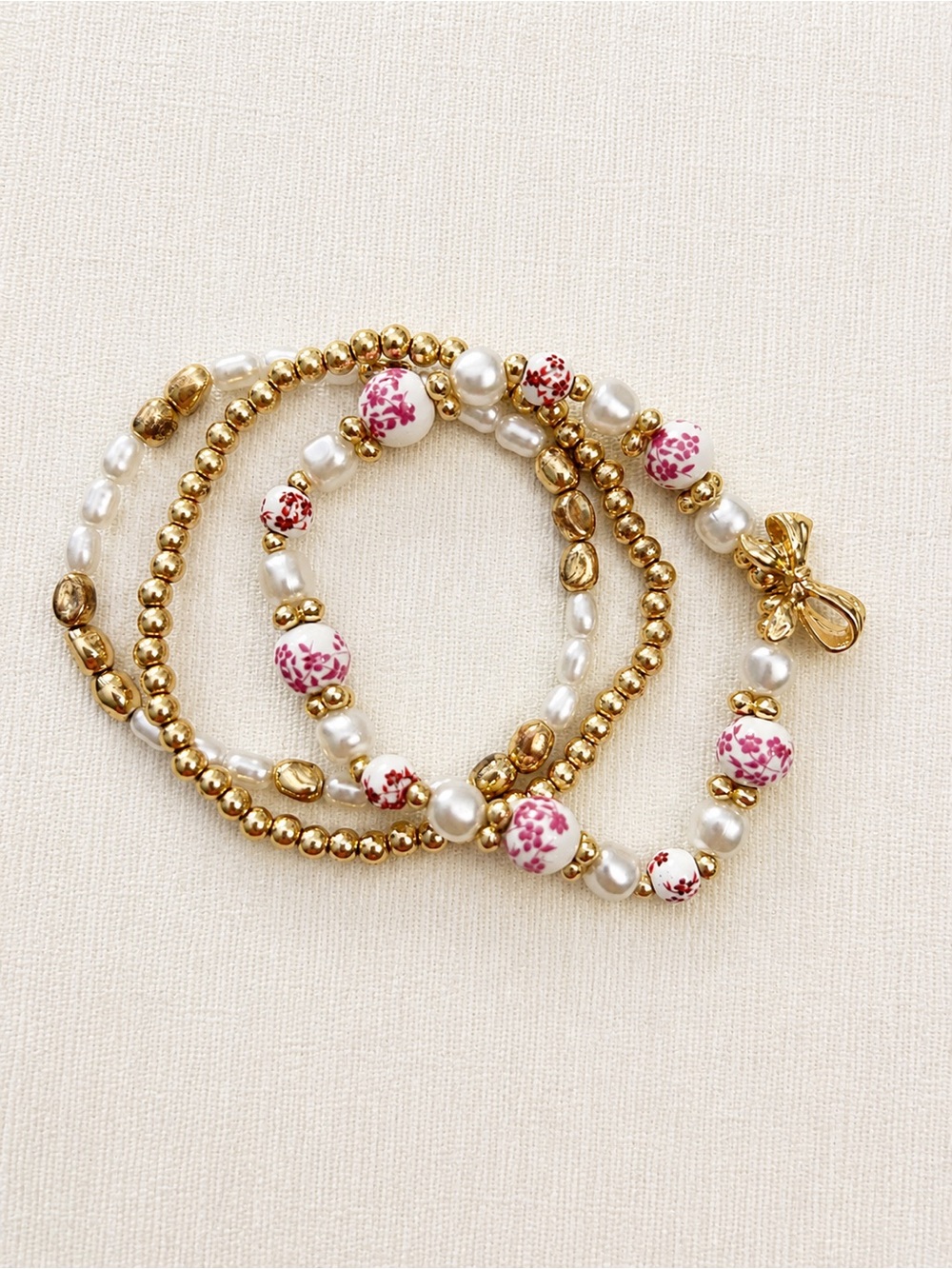 Gold and White Beaded Bracelet Set with Pink Floral Beads